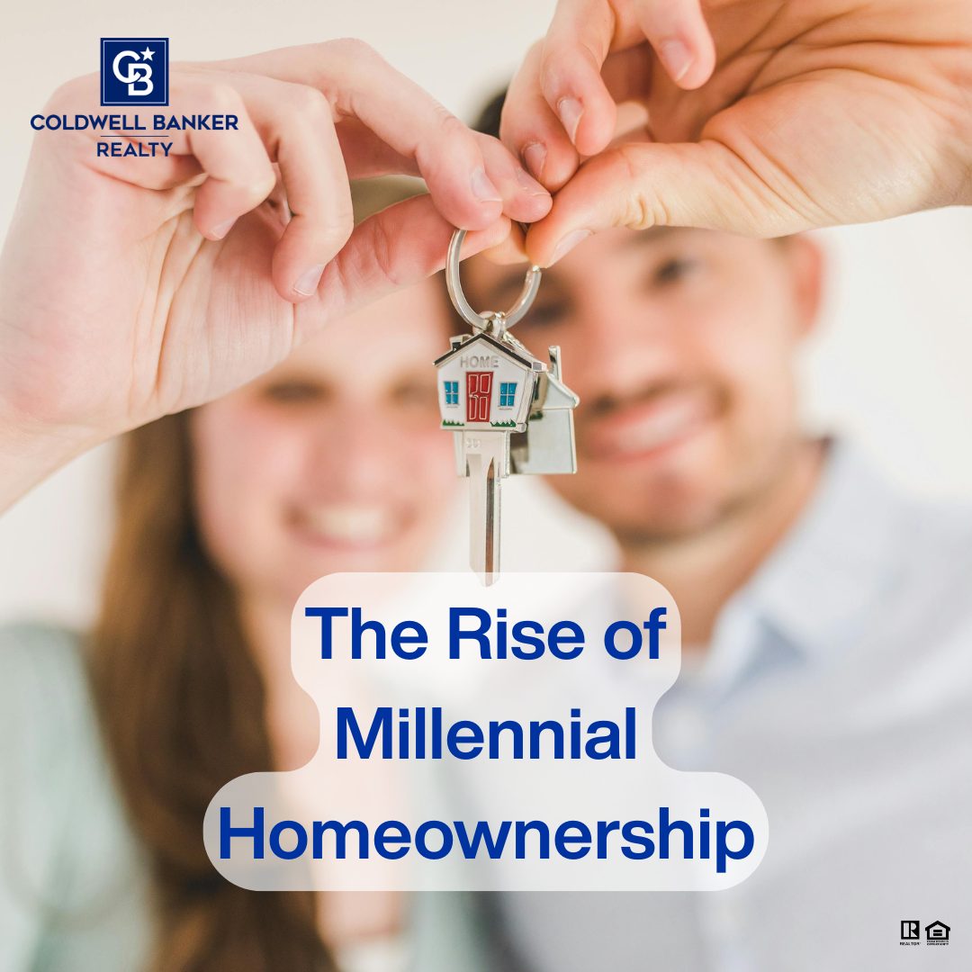 A smiling millennial couple holds a house-shaped keychain and new house keys together, symbolizing the rise of millennial homeownership. Coldwell Banker Realty branding appears in the corner.