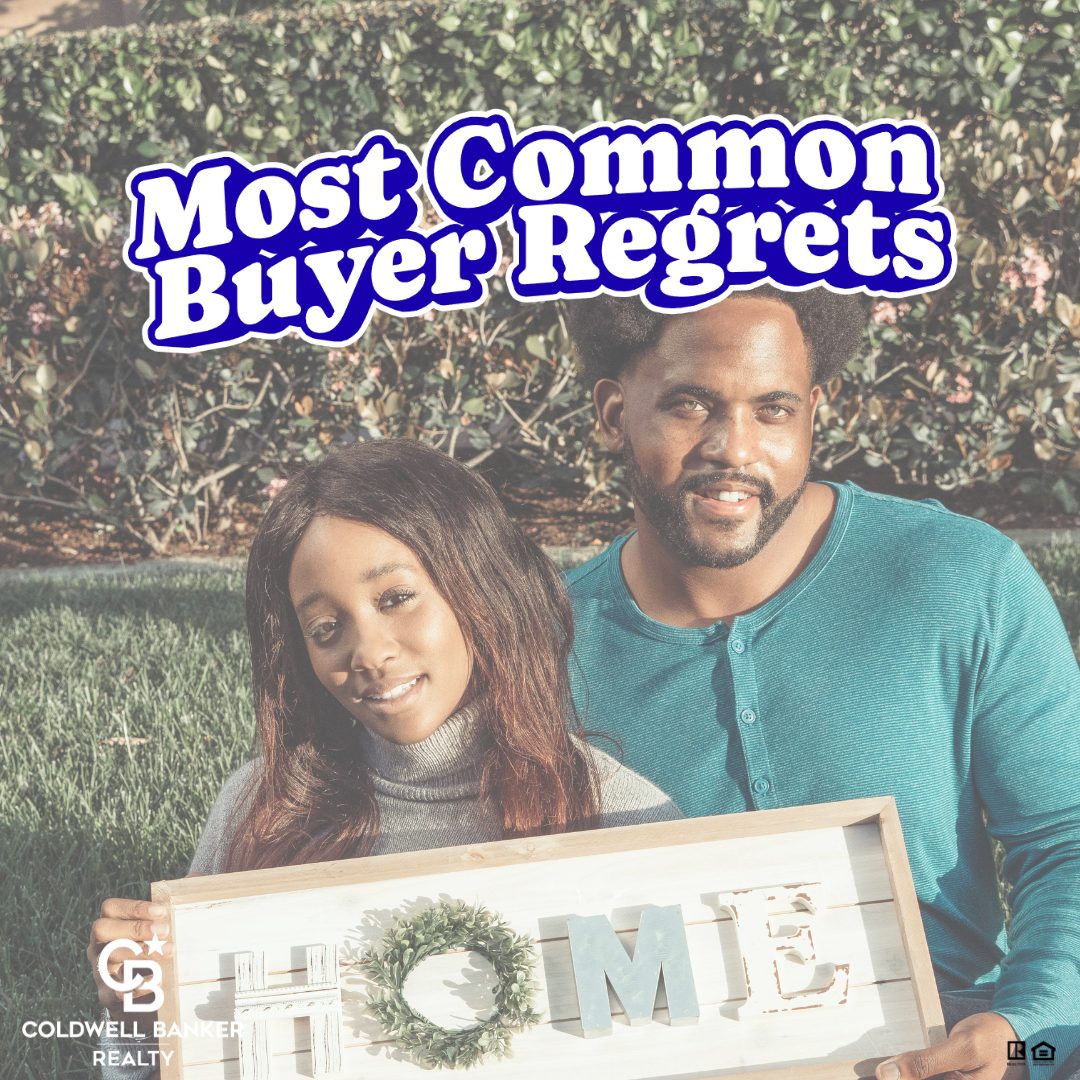 First-time homebuyers holding a “Home” sign outdoors, representing common buyer regrets and lessons learned when purchasing a first home in Cincinnati.